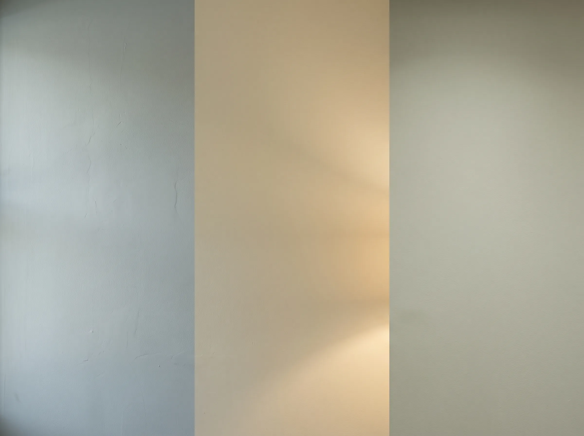 The same painted wall in three lighting conditions side by side: cool daylight reading grey, warm lamplight reading yellow, neutral LED reading true